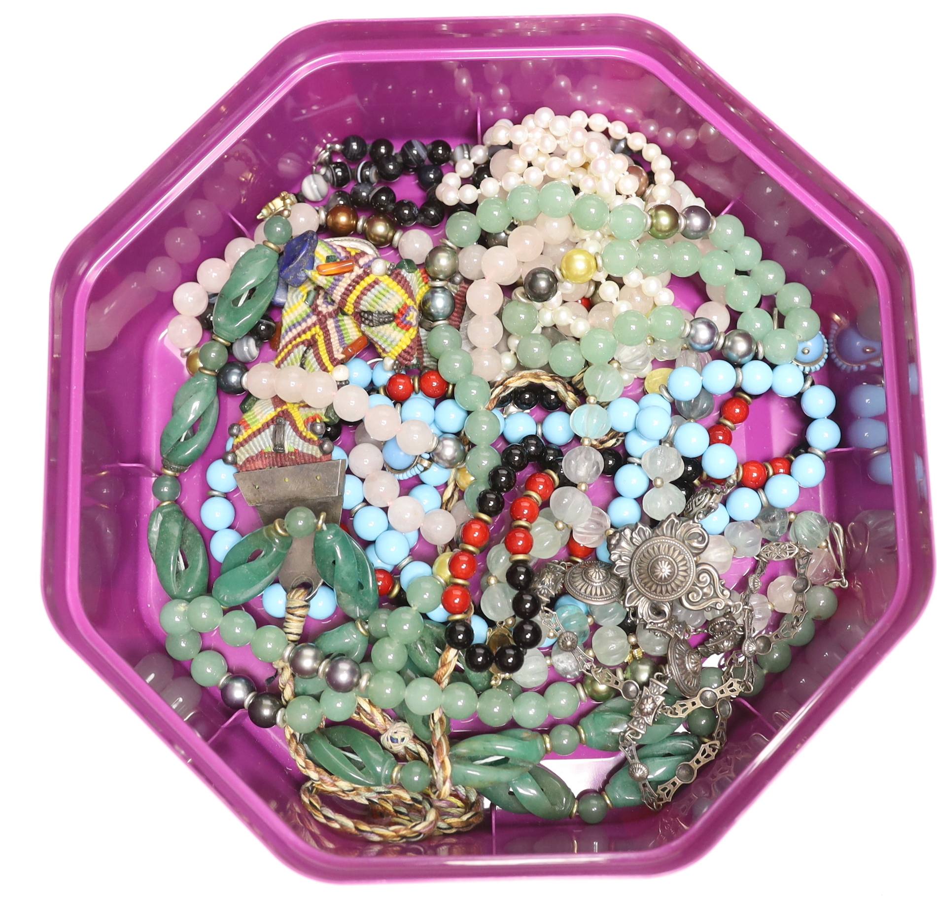A quantity of assorted jewellery including a banded agate bead necklace, a white metal necklace, a pair of yellow metal, turquoise and enamel ear clips, quartz necklaces etc